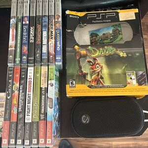 Very first Portable PSP 
carrying case& charger 
7 games & 8 movies